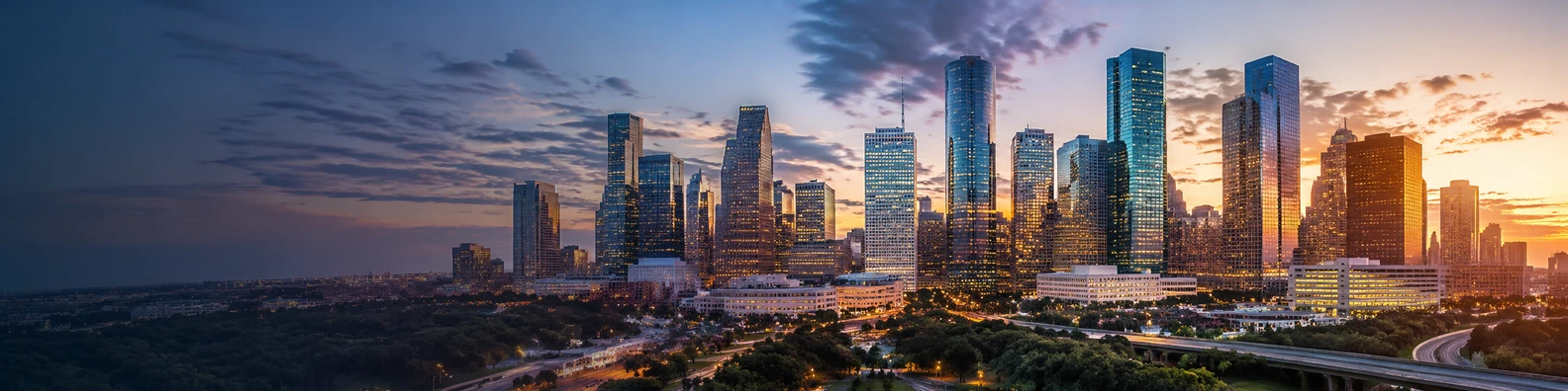 Atlanta skyline in the evening with warm city lights and soft twilight sky LinkedIn background banner