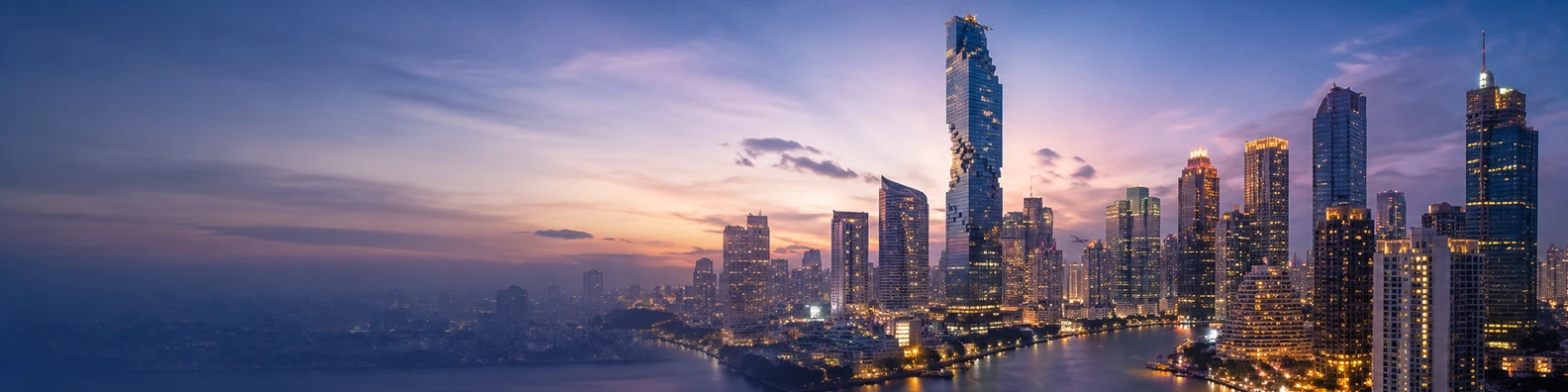 Bangkok city skyline with high-rise buildings, river reflections, and warm twilight lights LinkedIn banner