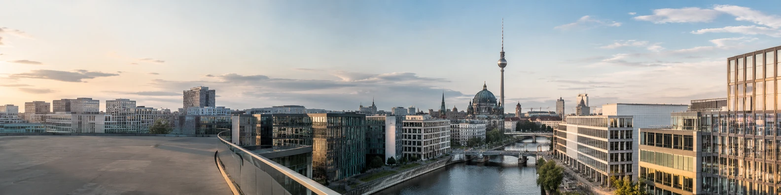 Modern Berlin cityscape with office buildings and soft evening light LinkedIn background banner