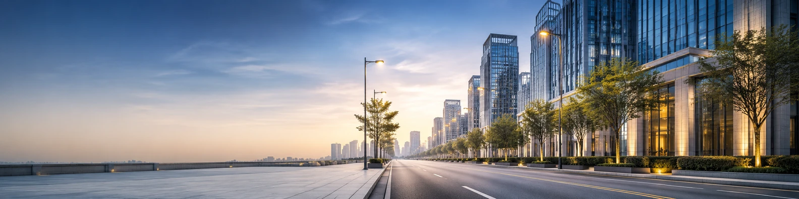 City avenue background with modern buildings, streetlights, clean sidewalks, and soft morning light LinkedIn banner