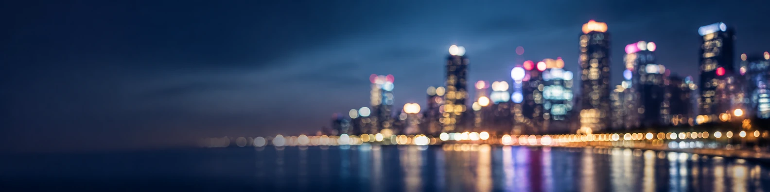 City lights bokeh background with softly blurred urban lights and evening atmosphere LinkedIn banner