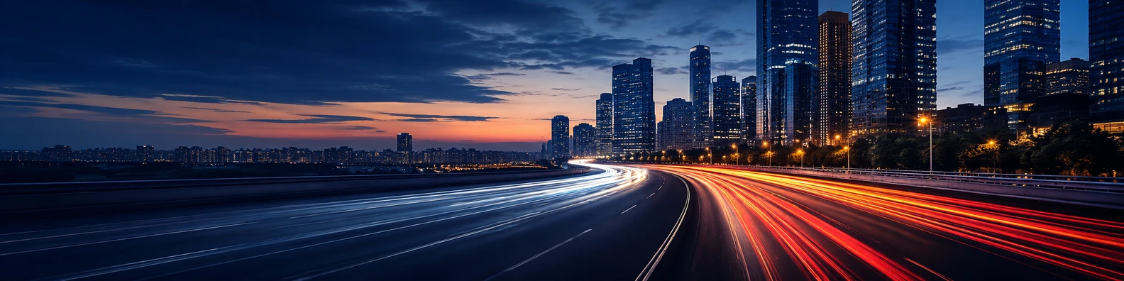 City traffic light trails on a wide urban road with modern buildings and evening sky LinkedIn banner