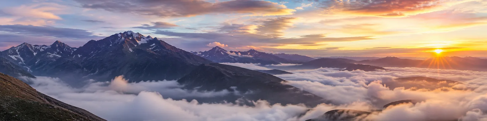 Cloudy mountain sunrise LinkedIn background banner with rugged peaks, soft morning clouds, golden light, and calm sky