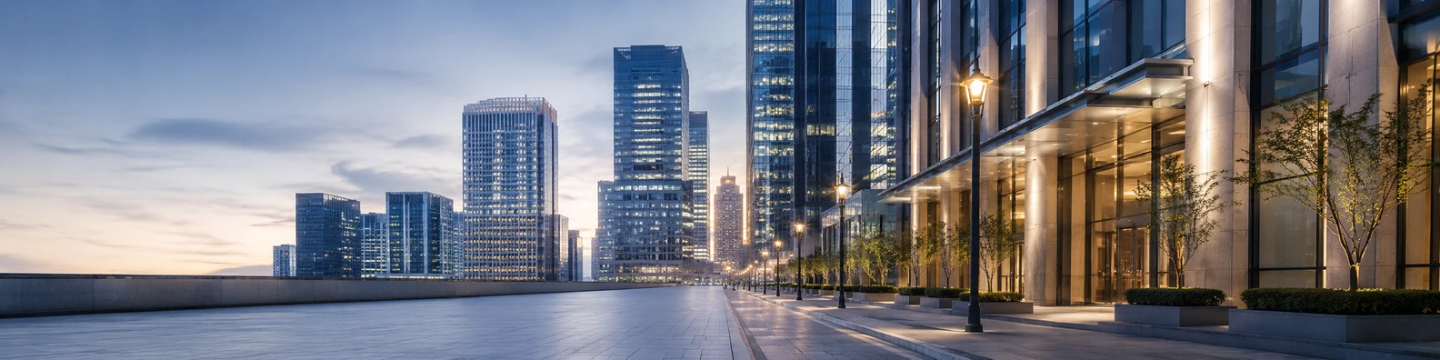 Corporate downtown street view with office buildings, glass facades, and soft streetlights LinkedIn banner