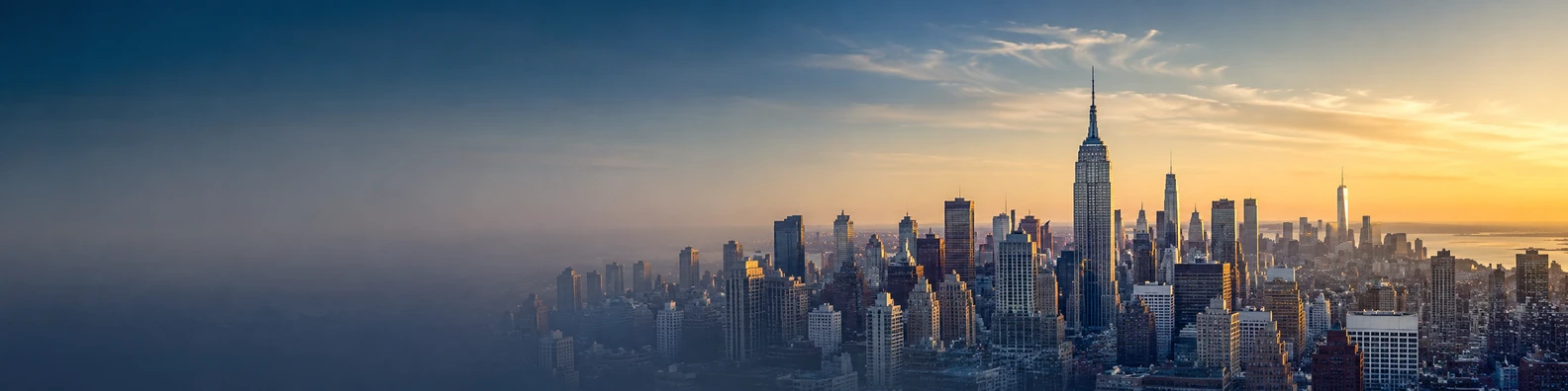 Empire State Building in a wide New York skyline at sunrise LinkedIn background banner
