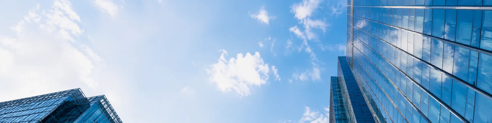 Glass buildings and blue sky urban LinkedIn background banner