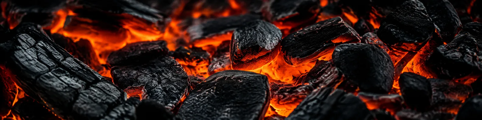 Glowing charcoal embers with orange heat and dark charred macro texture LinkedIn background banner