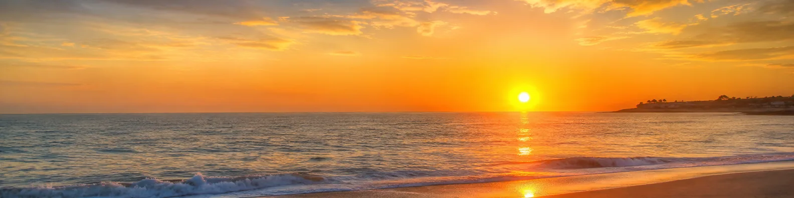 Golden ocean sunset with warm sunlight reflecting on calm waves LinkedIn background banner