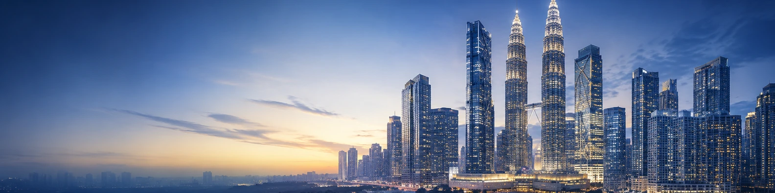 Kuala Lumpur skyline view with modern skyscrapers, twin towers, and glowing evening lights LinkedIn banner