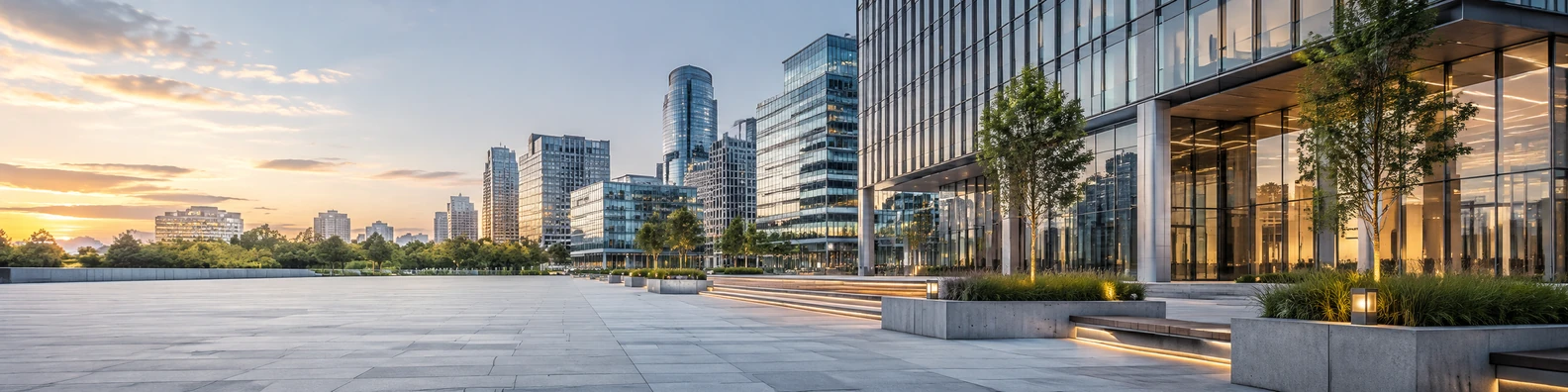 Modern urban plaza with glass office buildings and warm daylight LinkedIn background banner