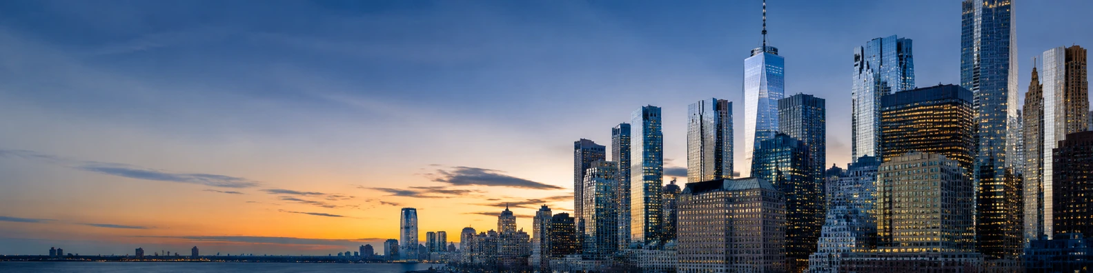NYC skyscrapers skyline view with glass towers and golden hour light LinkedIn background banner