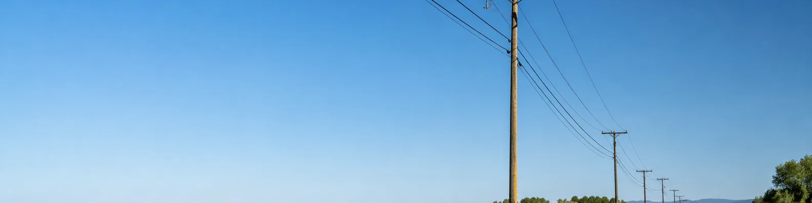Power lines and utility poles in a clear daytime landscape LinkedIn background banner