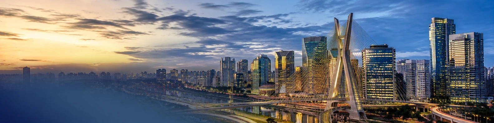 Sao Paulo urban skyline with dense modern buildings, bridge, and twilight city lights LinkedIn banner