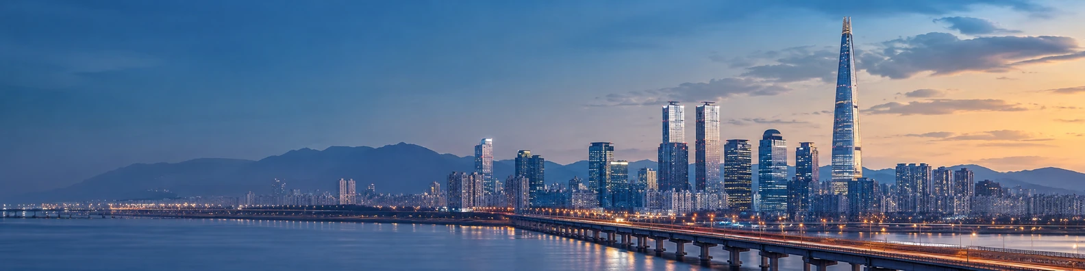 Seoul city skyline with river bridge, evening light, and modern high-rise buildings LinkedIn banner