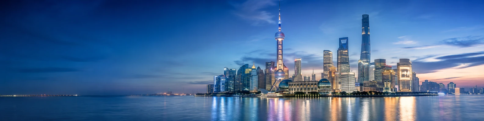 Shanghai skyline background with modern skyscrapers, waterfront reflections, and evening lights LinkedIn banner