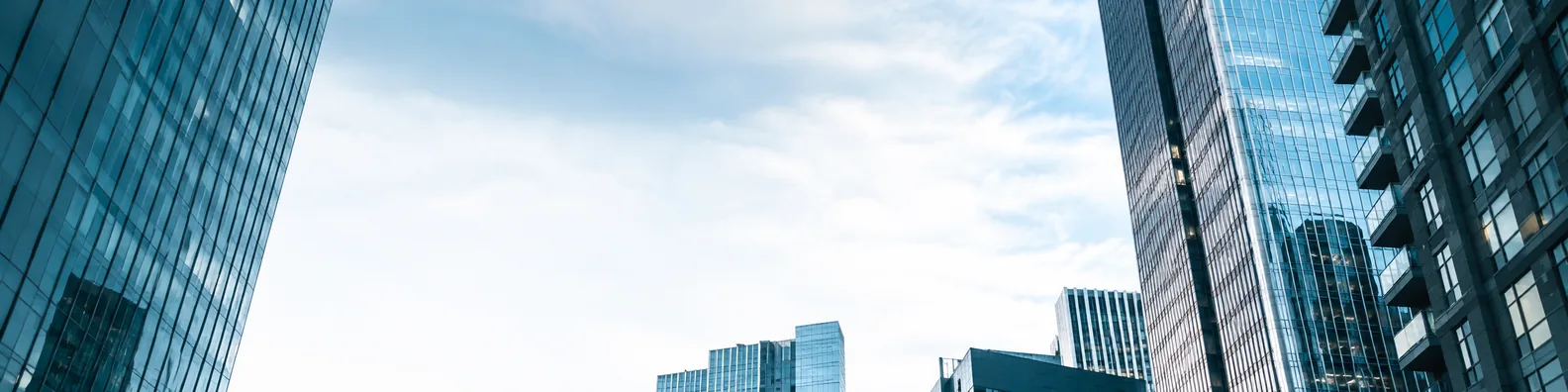 Tall urban buildings and open sky LinkedIn background banner