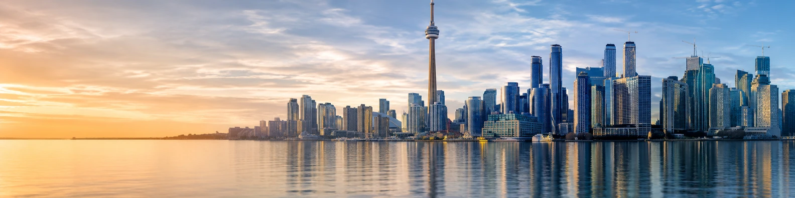 Toronto skyline lake view with waterfront reflections and soft sunrise light LinkedIn background banner