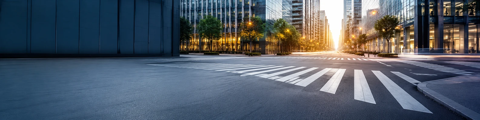 Urban crosswalk background with clean street lines, modern buildings, and warm sunset glow LinkedIn banner