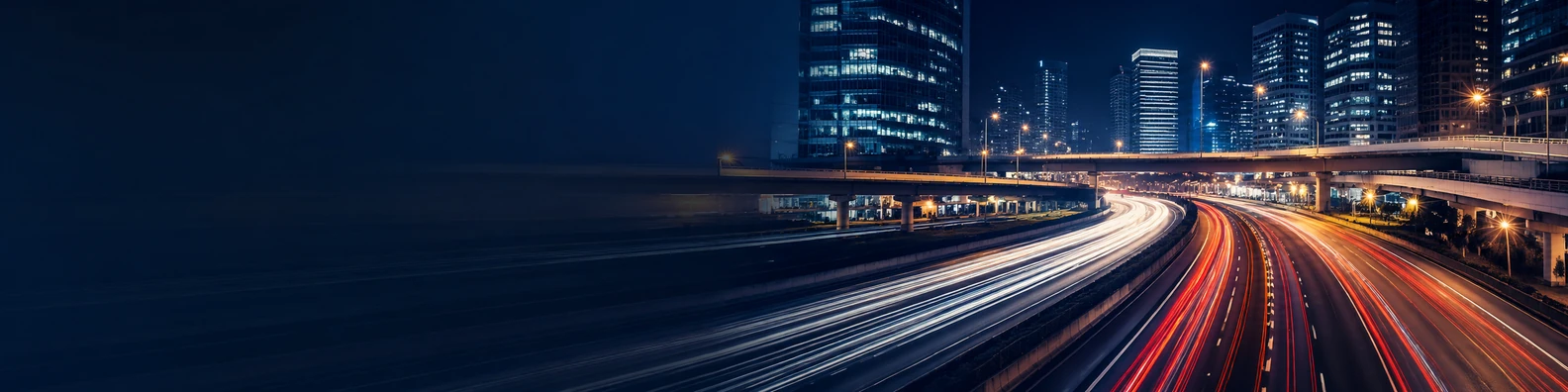 Urban highway light trails with city buildings, overpasses, and night road motion LinkedIn banner