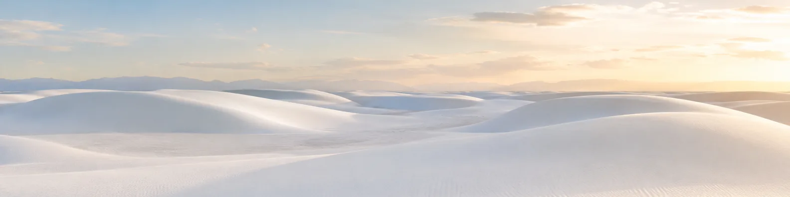 White sand desert LinkedIn background banner with smooth pale dunes, soft sky, gentle shadows, and minimalist natural light