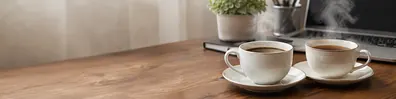 Coffee and tea together on a warm professional workspace LinkedIn background banner