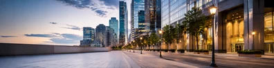 Downtown city street background with modern buildings, clean sidewalks, and warm city lights LinkedIn banner