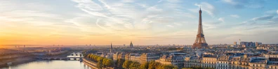 Eiffel Tower within a refined Paris urban skyline at golden hour LinkedIn background banner