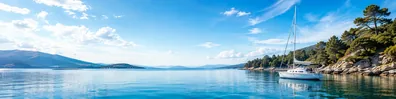 Calm sailboat and coastal water LinkedIn background banner