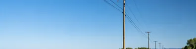 Power lines and utility poles in a clear daytime landscape LinkedIn background banner