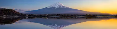 Mount Fuji reflected in still lake water with soft evening light LinkedIn background banner