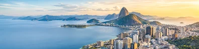 Rio De Janeiro city view with coastline, mountains, and warm golden light LinkedIn banner