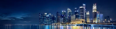 Singapore skyline night view with modern skyscrapers and calm waterfront reflections LinkedIn background banner