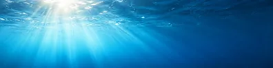 Sunlit deep ocean rays underwater LinkedIn background banner