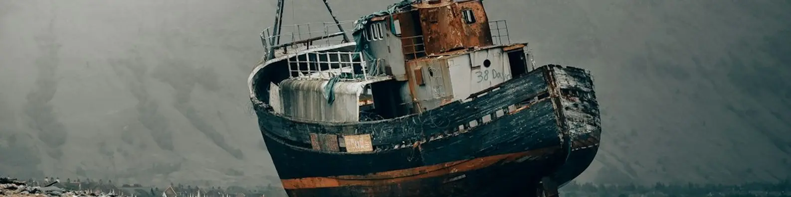 dramatic shipwreck over gray ocean banner