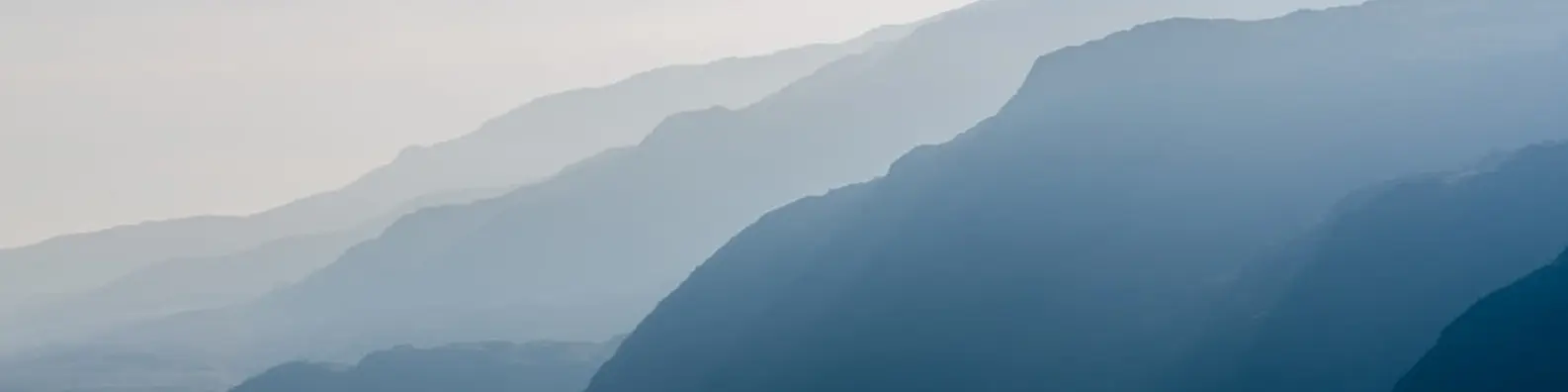 sunrise over misty mountain banner